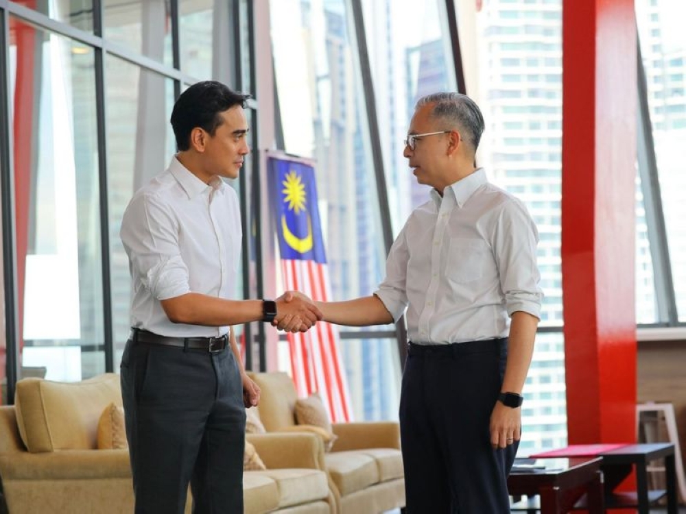 Communications Minister Datuk Fahmi Fadzil (right) welcomes former Astro Awani editor-in-chief Ashwad Ismail as the new Broadcasting director-general on February 23, 2026. — Picture from Facebook/Fahmi Fadzil