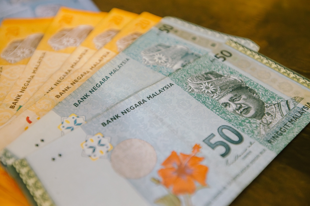 At 6 pm, the ringgit strengthened to 3.8885/8925 versus the greenback from last Friday’s close of 3.8995/9055. — Picture by Raymond Manuel