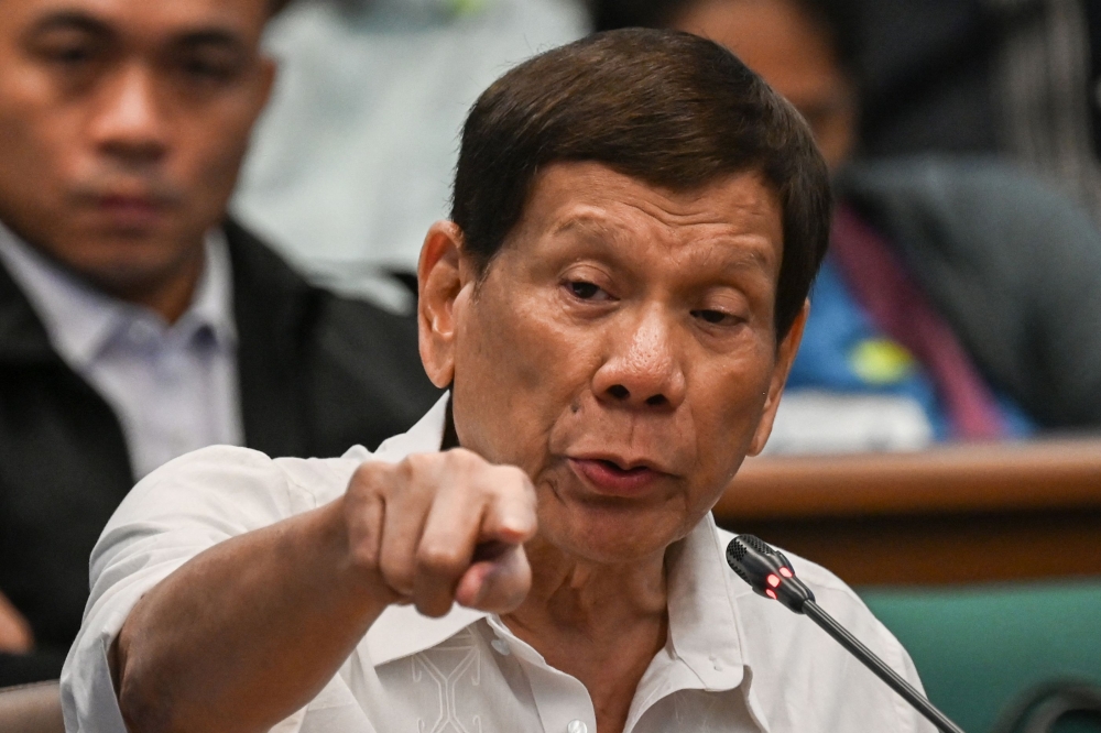 Former Philippine president Rodrigo Duterte faces three counts of crimes against humanity, with prosecutors alleging his involvement in at least 76 murders between 2013 and 2018.— AFP pic