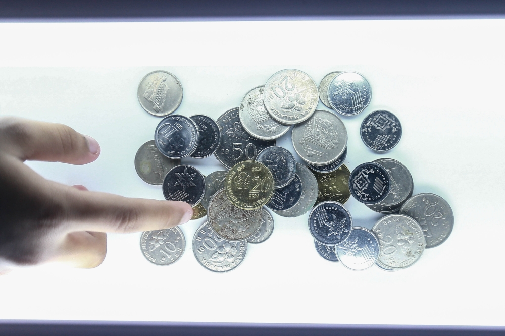 Under the Currency Act 2020, coins issued by BNM remain legal tender for payments of up to an aggregate value of 25 pieces in a single transaction. — Pictures by Sayuti Zainudin