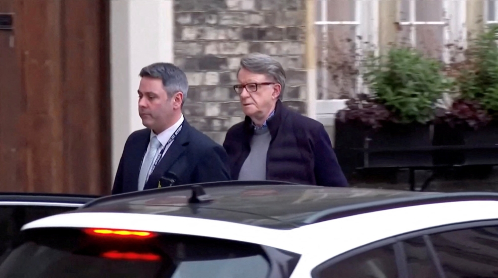 Former British Ambassador to the US Peter Mandelson (right) is led away from his home by a police officer as he is arrested on suspicion of misconduct in public office, following revelations over his ties to convicted sex offender Jeffrey Epstein, in London, Britain, February 23, 2026, in this screen capture from video. — BBC/Pool handout pic via Reuters