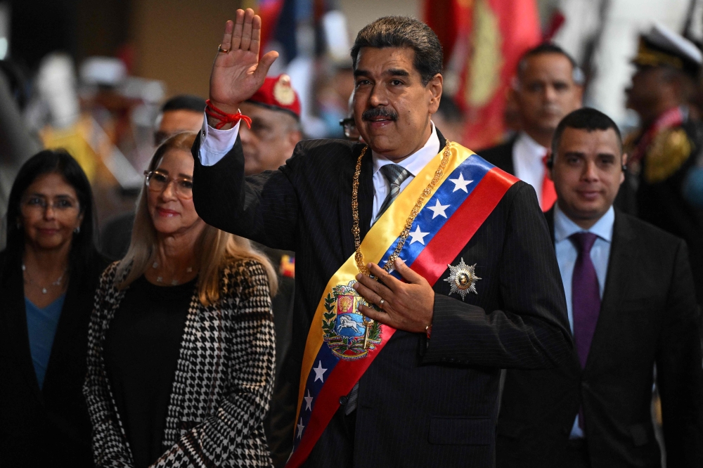File picture of Venezuela’s President Nicolas Maduro gesturing to supporters as he arrives with his wife Cilia Flores to deliver his annual speech to parliament in Caracas on January 15, 2025. Venezuela requested the United Nations on February 23, 2026 to secure the ‘immediate’ release of ousted Maduro, who is being held in the United States, while the release of political prisoners is moving forward in the country through an amnesty law enacted by interim President Delcy Rodriguez. — AFP pic 