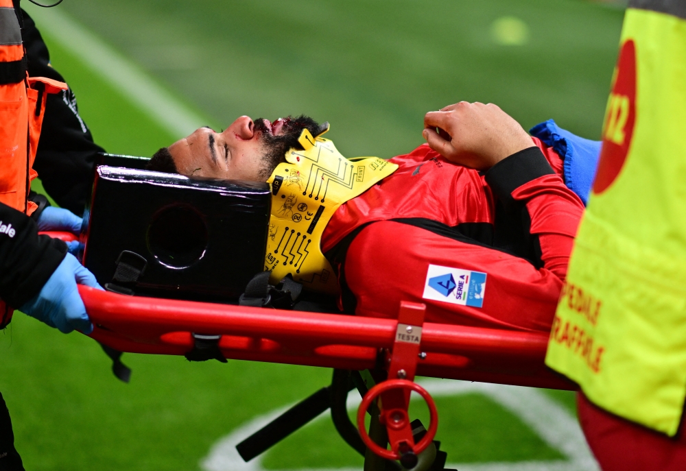 Milan’s Ruben Loftus-Cheek is carried off the pitch on a stretcher after sustaining an injury from a collision with Parma’s Edoardo Corvi at San Siro, Milan, February 22, 2026. — Reuters pic 