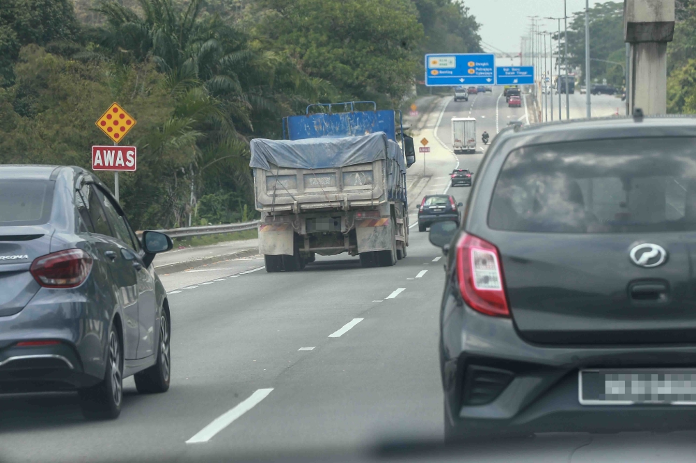 Tipper trucks are seen in the area during Ops Middleman in Nilai, Negeri Sembilan on February 24, 2026. — Picture by Sayuti Zainudin