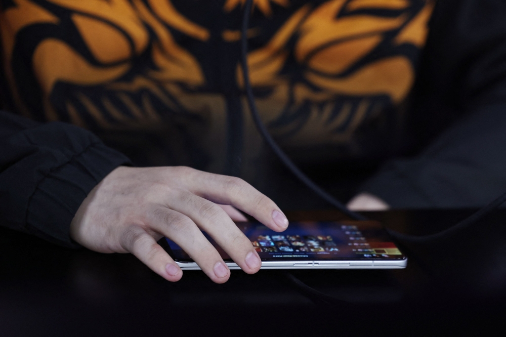 File picture of a player from Team Malaysia during the Arena of Valor Asian Games Version Final at the China Hangzhou Esports Centre, Hangzhou, September 26, 2023. Eight teams have been selected to anchor the Mobile Legends: Bang Bang (MLBB) Professional League Malaysia (MPL MY) under a newly launched long-term partnership programme. — Reuters pic