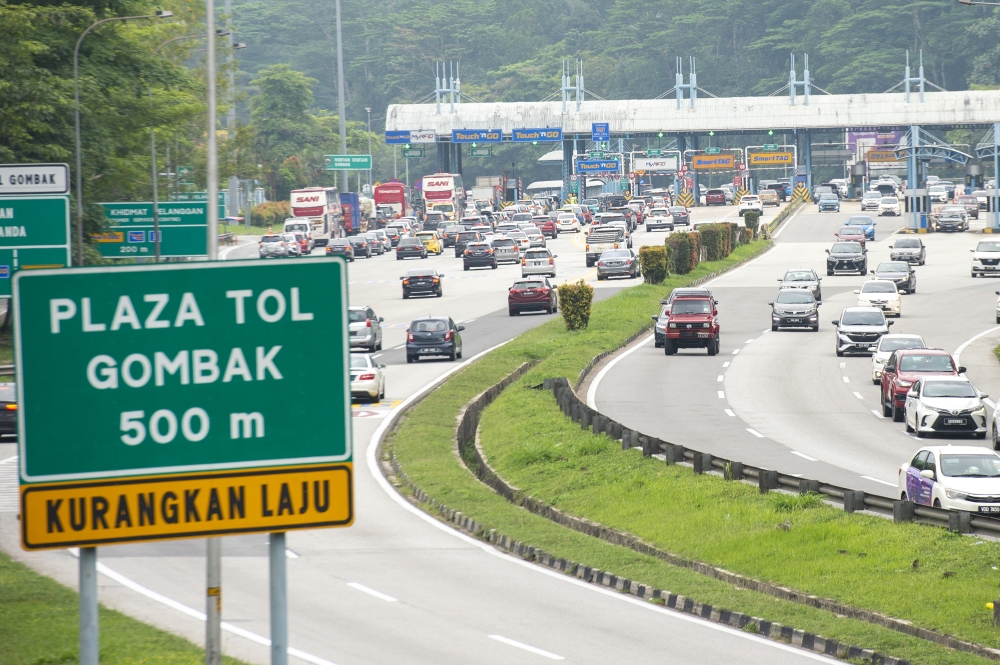 Works Minister Datuk Seri Alexander Nanta Linggi said the government is paying the price by sparing the public any increase to toll fares for now. — File picture by Shafwan Zaidon