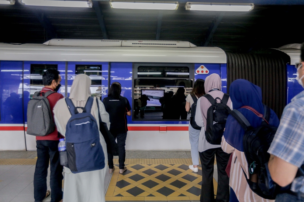 Commuters wait at the Kerinchi LRT Station in Bangsar South, Kuala Lumpur on April 20, 2024. — Picture by Sayuti Zainudin