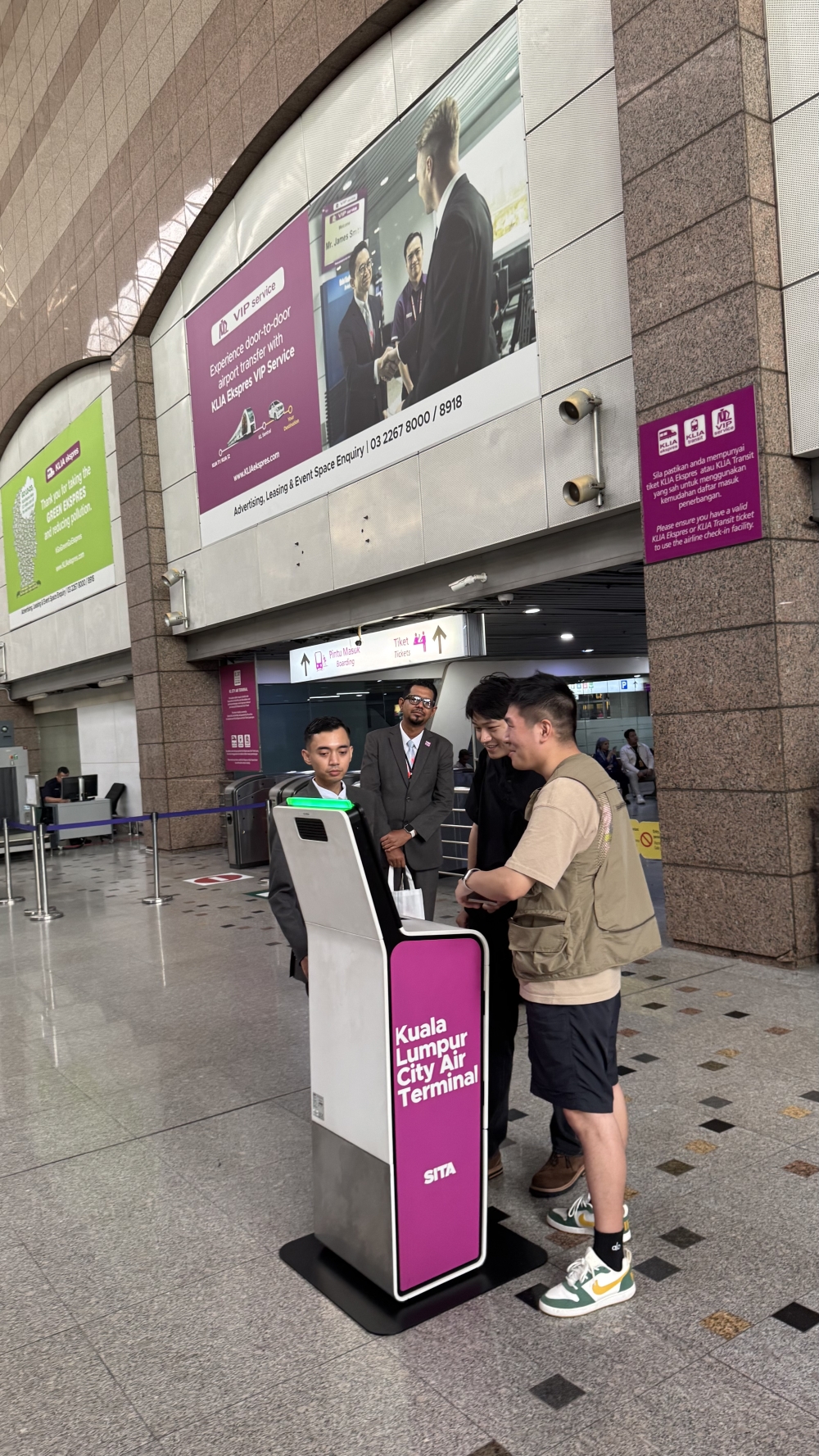 Passengers testing the new self check-in kiosk at KL Sentral, part of ERL’s push for a smoother city-to-airport journey. — Picture courtesy of Express Rail Link
