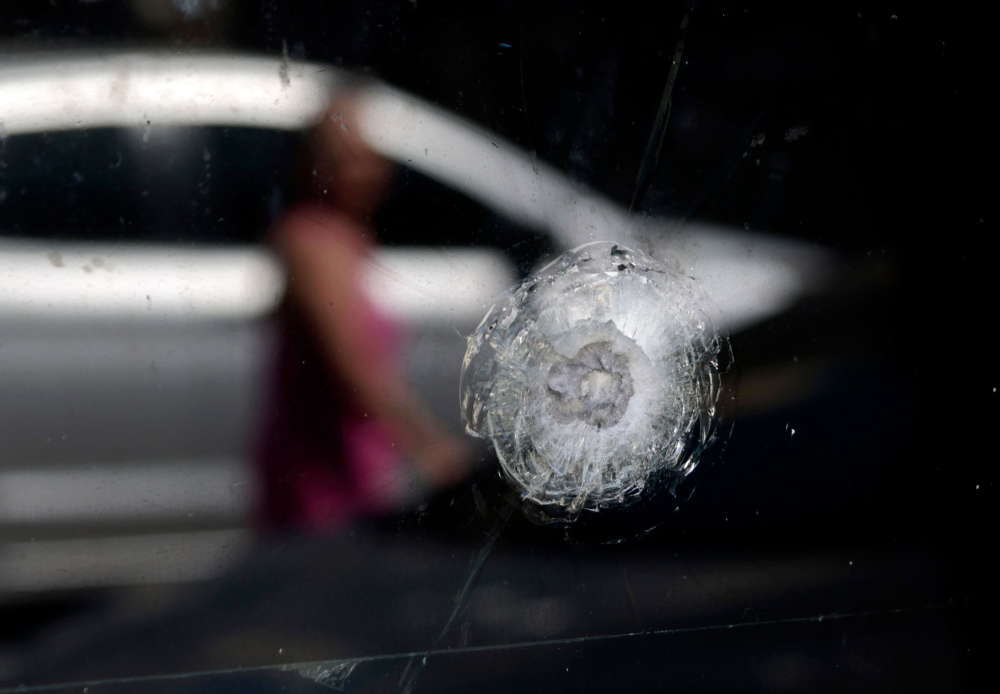View of a bullet impact on the window of a police station in Guadalajara, Jalisco, Mexico, on February 23, 2026, a day after clashes. — AFP pic
