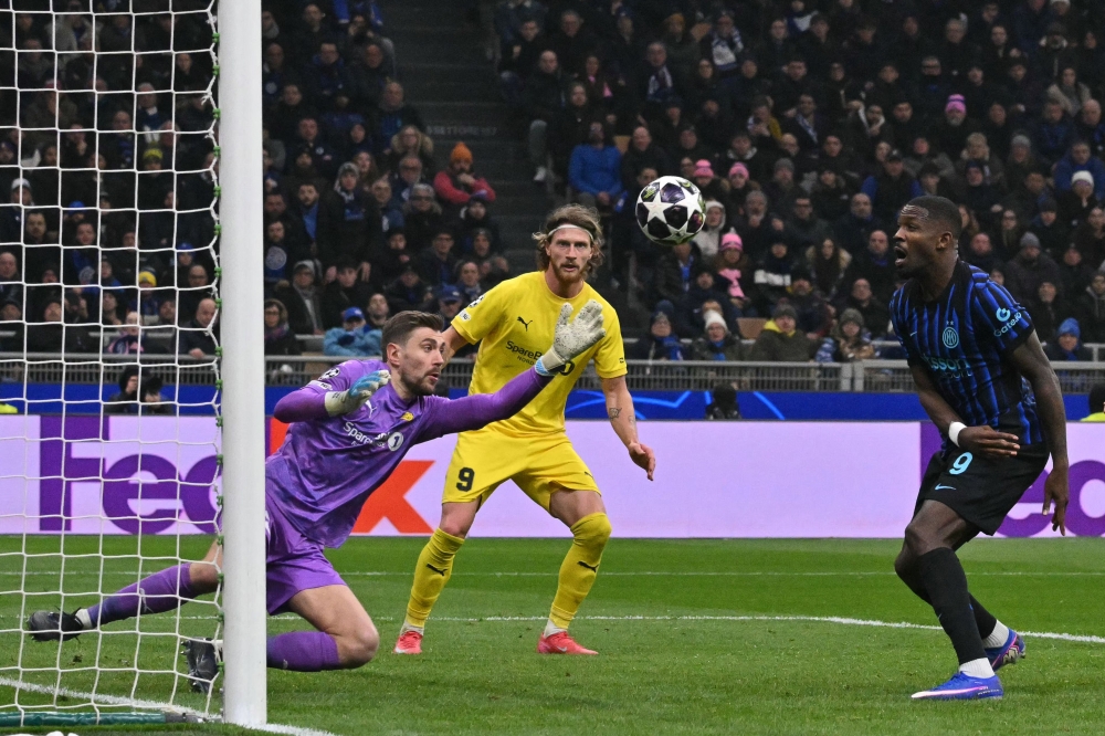 Bodo/Glimt goalkeeper Nikita Haikin dives to make a save during the Champions League play-off against Inter Milan at San Siro in Milan February 24, 2026. — AFP pic