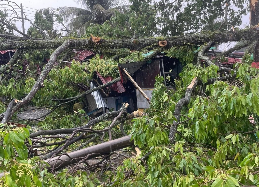 The storm damaged the roofs of homes and businesses, Ramadan bazaar tents, a mosque walkway, cemetery fences, the roof of Taman Pengkalan Indah surau, and several vehicles. — Picture from social media 
