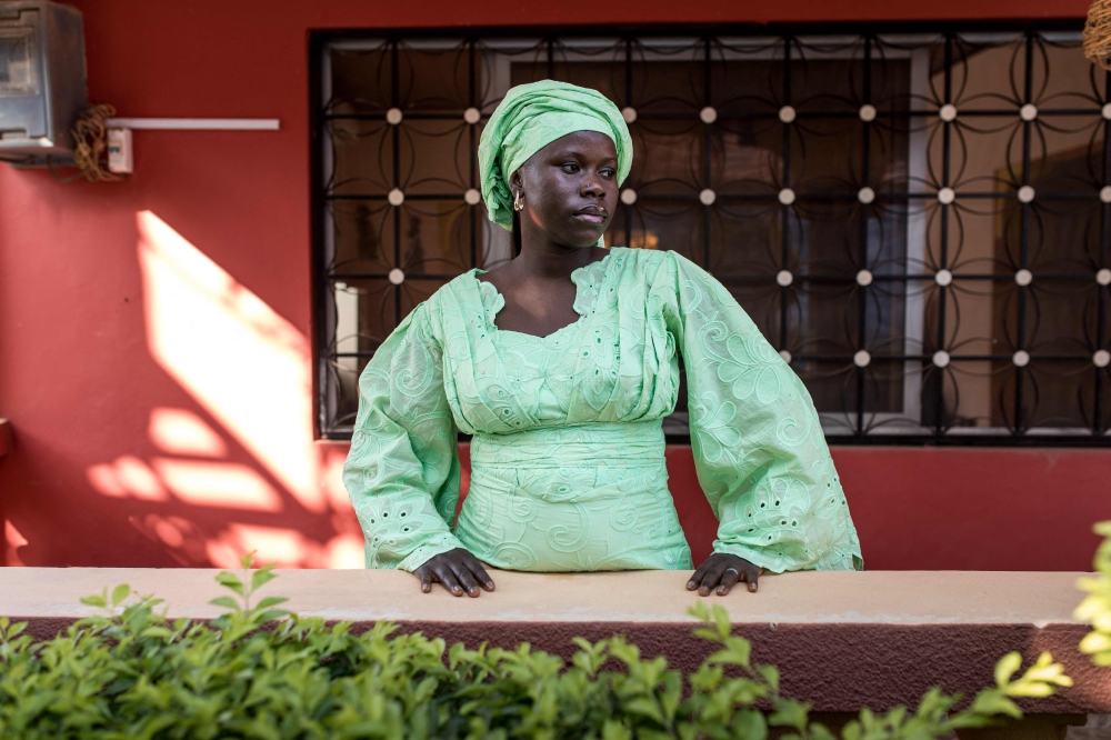 Mariama Fatajo, a Female Genital Mutilation (FGM) survivor and victim support assistant at the Women's Association for Victims Empowerment (WAVE), poses for portrait at her workplace in Manjai Kunda, on January 30, 2026. — AFP pic