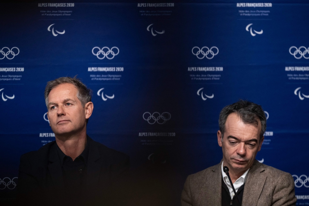 Edgar Grospiron (left), former Olympic skiing champion and President of the Coordination Commission for the 2030 Winter Olympics in France, and Cyril Linette (right), CEO of the organising committee for the 2030 French Alps Olympic Games, attend a press conference of the Coordination Committee for the 2030 French Alps Winter Olympics in Le Grand Bornand, central eastern France, on December 3, 2025. — AFP pic