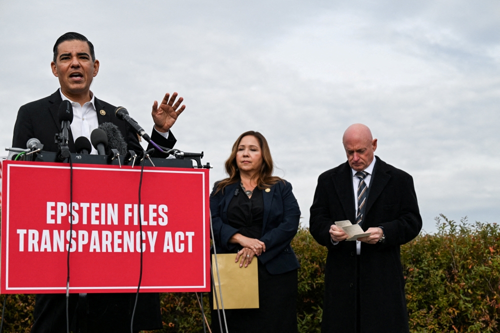 US Representative Robert Garcia (D-CA) speaks next to US Senator Mark Kelly (D-AZ) and US Representative Adelita Grijalva (D-AZ) at a press conference calling for the release of the Epstein files, on Capitol Hill in Washington, D.C. November 18, 2025. — Reuters pic