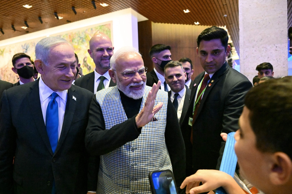 Israeli Prime Minister Benjamin Netanyahu and Indian Prime Minister Narendra Modi greet children in the Knesset, the Parliament, in Jerusalem on February 25, 2026. Modi arrived in Israel yesterday for a two-day visit aimed at deepening ties with a key trade and defence partner, a trip that has drawn criticism at home. 