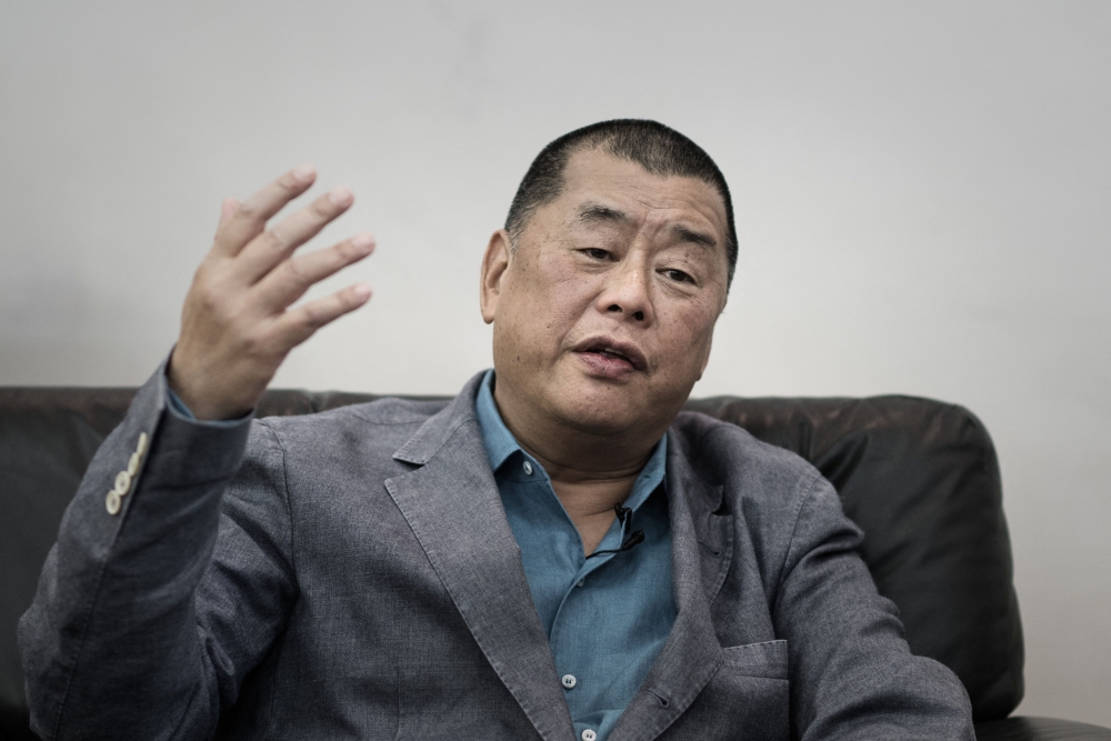 Hong Kong pro-democracy media tycoon Jimmy Lai won an appeal over his 2022 fraud conviction, in a surprise ruling that quashed the sentence unrelated to his separate national security case. — AFP pic