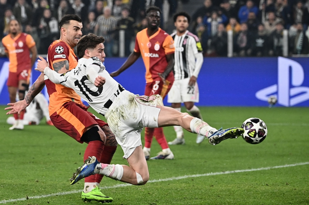 Juventus’ Turkish forward  #10 Kenan Yildiz kicks the ball next to Galatasaray’s Turkish defender #42 Abdulkerim Bardakci during the Uefa Champions League, knockout round play-off second leg, football match between Juventus FC and Galatasaray SK at the Allianz stadium in Turin, on February 25, 2026. — AFP pic 
