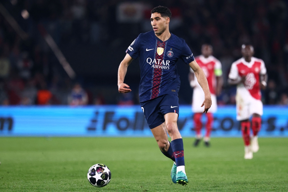 Paris Saint-Germain’s Moroccan defender #02 Achraf Hakimi runs with the ball during the Uefa Champions League play-off second leg football match between Paris Saint-Germain (PSG) and AS Monaco at the Parc des Princes stadium in Paris on February 25, 2026. — AFP pic 