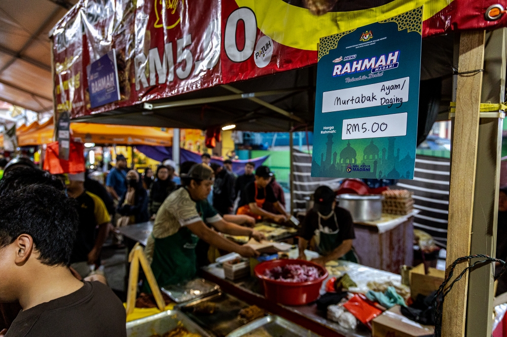 A vendor prepares food at a Ramadan bazaar during the holy month of Ramadan at Kampung Baru on February 25, 2026. — Picture by Firdaus Latif