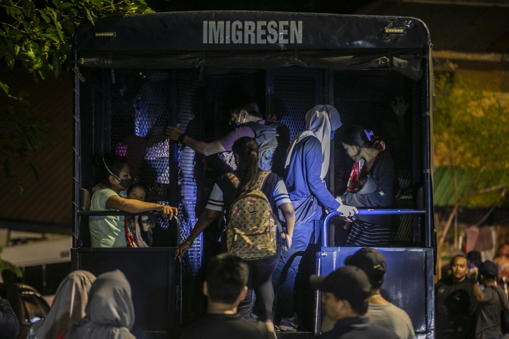 A total of 92 illegal immigrants (PATI) in Kampung Masjid Segambut were checked in the raid and of that number, a total of 76 illegal immigrants (PATI) from Indonesia and Bangladesh were detained involving 46 men, 23 women, six boys and a girl. The raid was part of a large-scale operation announced by Home Minister Datuk Seri Hamzah Zainuddin following the Return Calibration Program which ended on June 30, July 1, 2022. - Picture by Hari Anggara