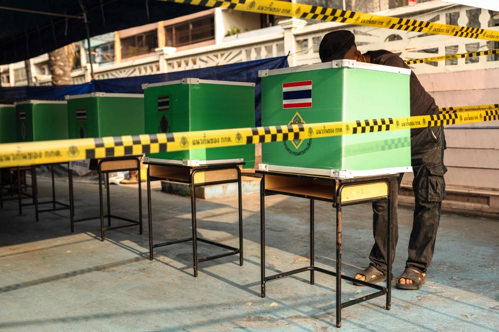 A man casts his ballot in Thailand's general election at a polling station in Bangkok on February 8, 2026. A Thai political party that came second in this month's vote filed a criminal complaint today against the nation's election commissioners, accusing them of violating election laws, the party's deputy told AFP. — AFP pic 