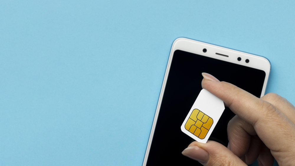 A person holds a SIM card in this undated illustrative photo. According to MCMC, when you want to replace your SIM card, you can only do it through your telco, and the telco will have to verify your identity through biometric authentication or MyDigital ID. — Freepik pic