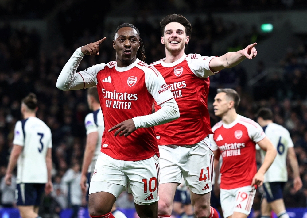 Arsenal’s Eberechi Eze celebrates scoring their third goal against Tottenham Hotspur with Declan Rice at Tottenham Hotspur Stadium, London, February 22, 2026. — Reuters pic 