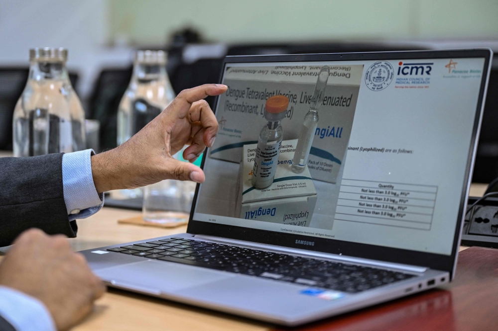 Chief scientific officer Syed Khalid Ali explains the development of the DengiAll vaccine’s clinical sample at Panacea Biotec, a pharmaceutical company in New Delhi in the final stage of testing, raising hopes for one of the world’s first single-dose shots against the deadly mosquito-borne disease. — AFP pic