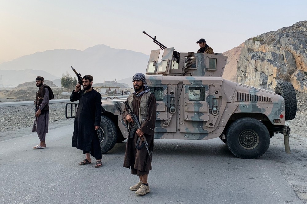 Taliban security personnel stand guard near the Torkham border crossing between Afghanistan and Pakistan in the Nangarhar province on February 27, 2026. — AFP pic