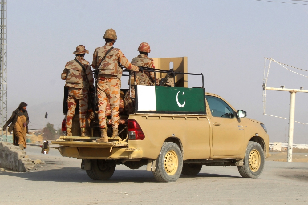 Pakistani soldiers patrol near the Pakistan-Afghanistan border crossing in Chaman on February 27, 2026, following overnight cross-border fighting between the two countries. — AFP pic