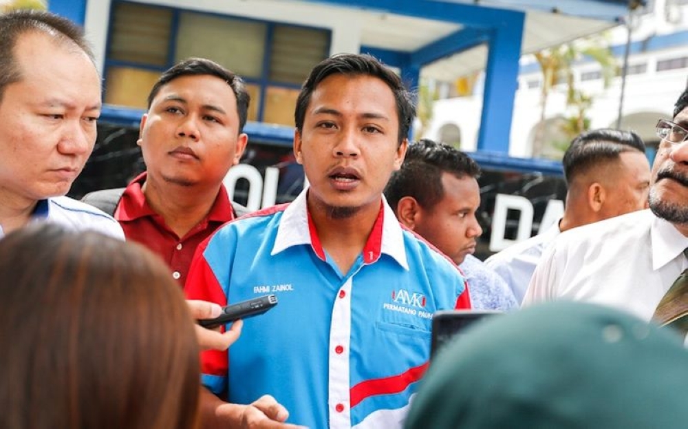 ahmi Zainol speaks to the press outside the Northeast district police station in George Town on April 9, 2019. — Picture by Sayuti Zainudin