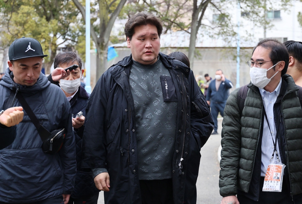 Sumo stablemaster Isegahama (centre), formerly the highest-ranking yokozuna Terunofuji speaks to reporters in Osaka City on February 27, 2026. — Jiji Press/Japan Out/AFP pic