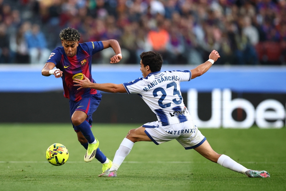 FC Barcelona’s Lamine Yamal in action with Levante’s Manu Sanchez at Spotify Camp Nou, Barcelona, February 22, 2026. — AFP pic 
