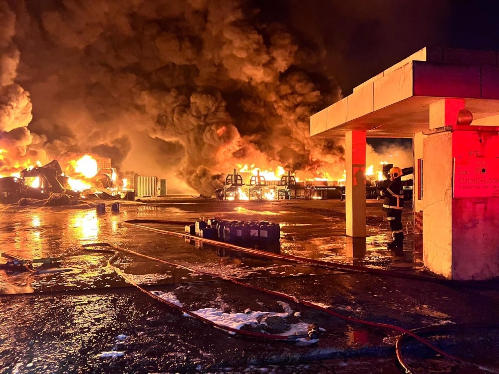 Flames erupt at the peak of Tuesday night’s fire that gutted a rubber and plastic warehouse in the Sengkang Industrial Area, near Kulai. — Picture courtesy of the Johor Fire and Rescue Department