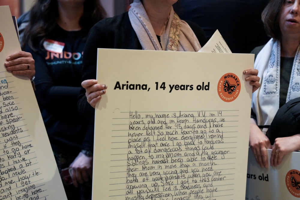 People hold placards with letters written by children held in ICE detention centres, during a protest against ICE and immigration enforcement actions organised by Unidos MN, inside the Minnesota State Capitol building, in St. Paul, Minnesota February 26, 2026. — Reuters pic 