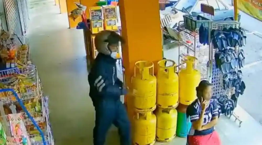 According to the report, the victim, a local woman, was sitting in front of a grocery store while speaking on the phone when a male suspect approached from behind and grabbed the necklace she was wearing. — Screenshot via social media