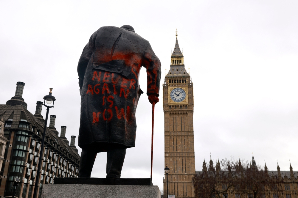 Graffiti reading 'Never again is now' is pictured on a statue of Britain痴 former Prime Minister Winston Churchill in Parliament Square, in central London on February 27, 2026. — AFP pic 