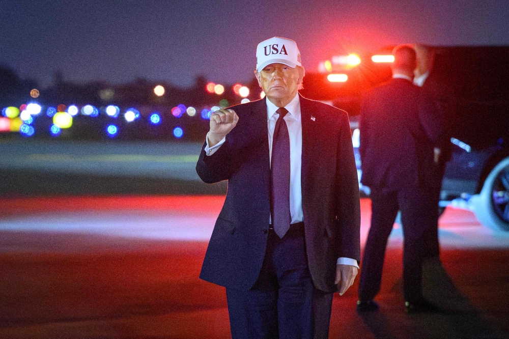 US President Donald Trump gestures as he arrives at Palm Beach International Airport in West Palm Beach, Florida on February 27, 2026. Trump is spending the weekend at his Mar-a-Lago resort. — AFP pic