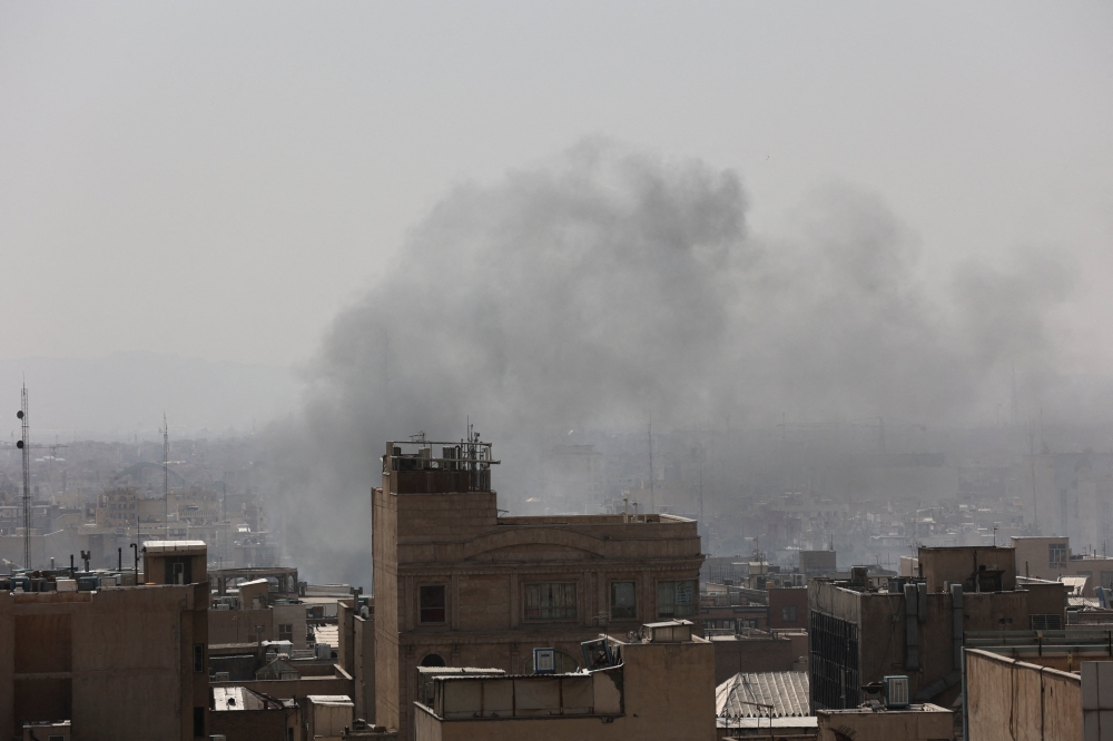 Smoke rises following an explosion, after Israel and the US launched strikes on Iran, in Tehran, Iran, February 28, 2026. — WANA (West Asia News Agency) handout via Reuters