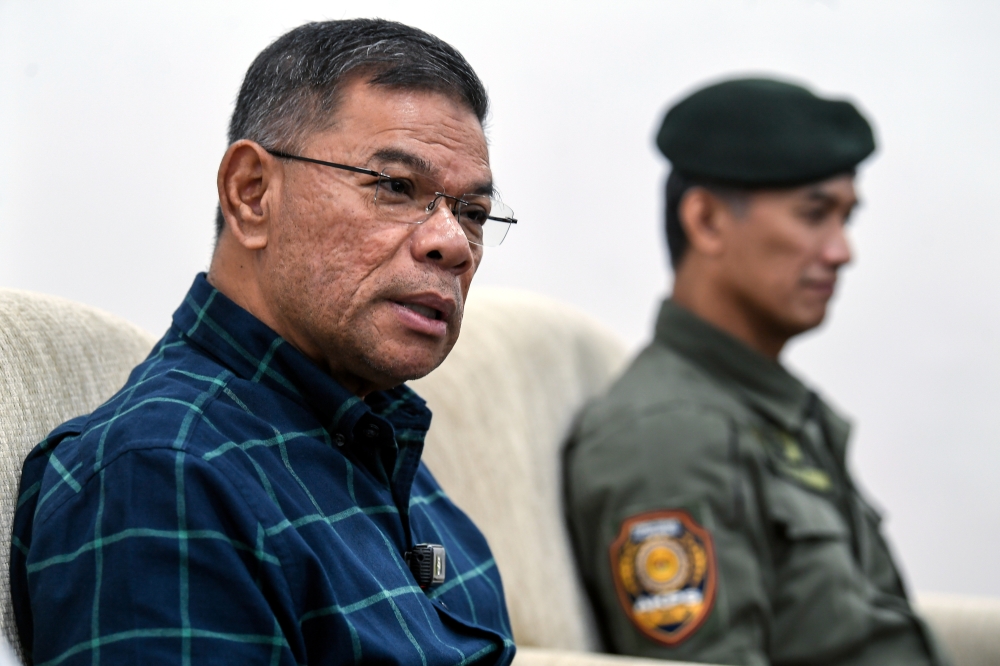 Home Minister Datuk Seri Saifuddin Nasution Ismail speaks at a press conference after an official visit to the Malaysian Border Control and Protection Agency (AKPS) entry point at the Bukit Kayu Hitam Immigration, Customs, Quarantine and Security (ICQS) Complex today. — Bernama pic