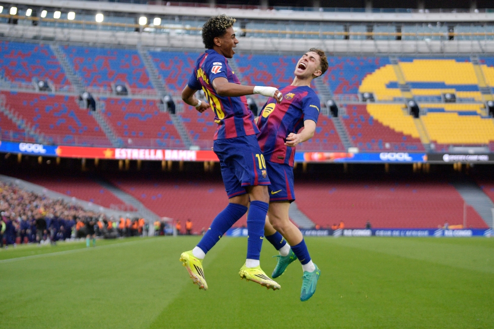 Barcelona’s Spanish forward Lamine Yamal celebrates scoring the opening goal with teammate Fermin Lopez during the Spanish league match against Villarreal CF at Camp Nou Stadium in Barcelona on February 28, 2026. — AFP pic