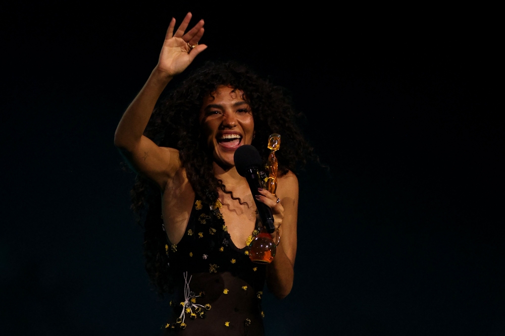 British singer-songwriter Olivia Dean celebrates on stage after receiving the award for Artist of the year during the BRIT Awards 2026 at the Co-op Live arena, in Manchester on February 28, 2026. — AFP pic