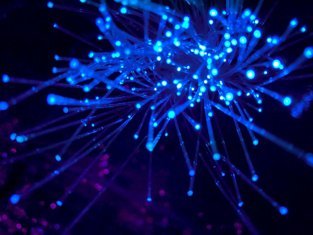 Optical fibre sends signals using light travelling through glass. Instead of moving electrons, it uses tiny packets of light energy, known as photons. — Unsplash pic/JJ Ying