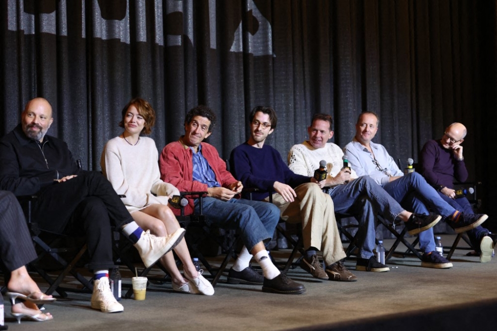 Director/Producer Yorgos Lanthimos, actress/producer Emma Stone, cinematographer Robbie Ryan, composer Jerskin Fendrix, sound designer Johnnie Burn, producers Andrew Lowe and Ed Guiney attend 'Bugonia' Bafta Screening at Pacific Design Center on October 25, 2025 in West Hollywood, California. — Getty Images via AFP