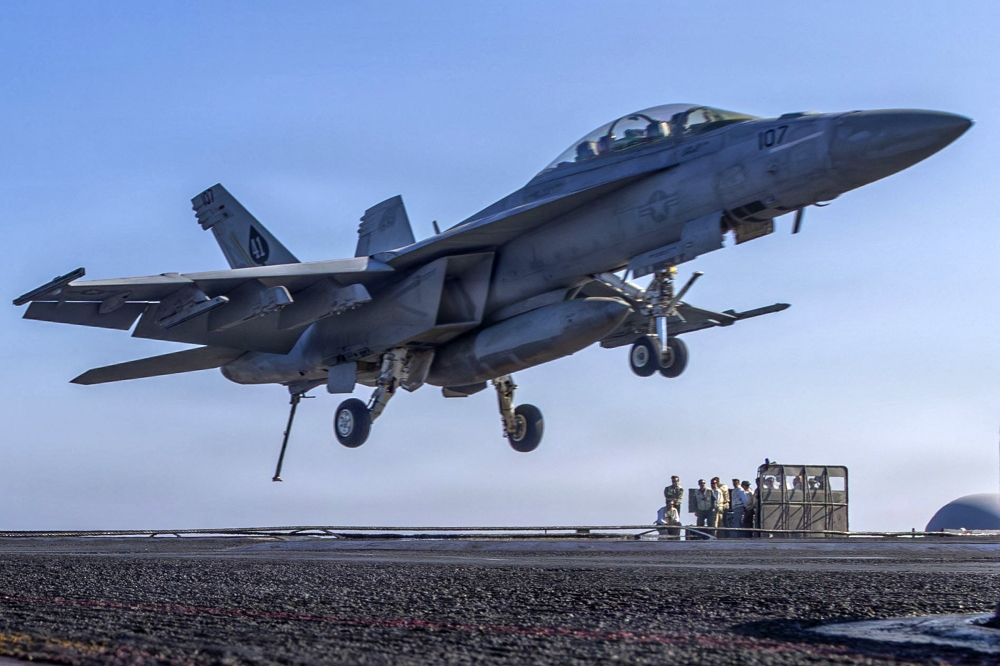 In this handout photograph released by the US Navy, an F/A-18F Super Hornet, attached to Strike Fighter Squadron (VFA) 41, prepares to make an arrested landing on the flight deck of Nimitz-class aircraft carrier USS Abraham Lincoln (CVN 72) in the Arabian Sea on February 15, 2026. — Daniel Kimmelman/US Navy handout/AFP pic
