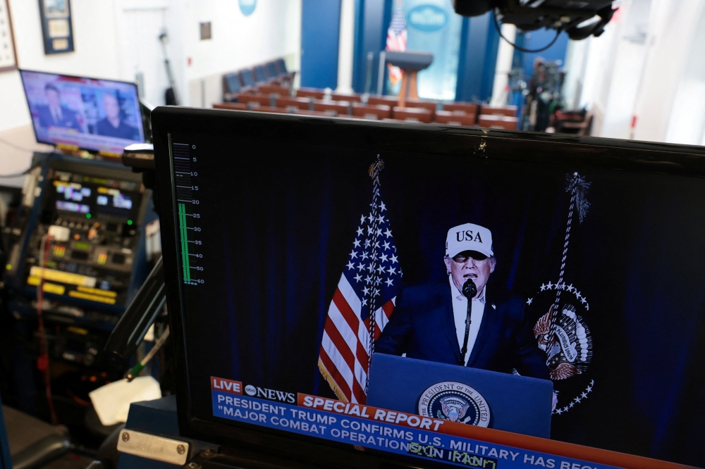 A television monitor shows US President Donald Trump’s earlier announcement in the otherwise empty press briefing room at the White House, while US President Trump is away at his Mar-a-lago Club in Palm Beach, Florida, on the day the United States and Israel led attacks on Iran, in Washington, D.C. February 28, 2026. — Reuters pic