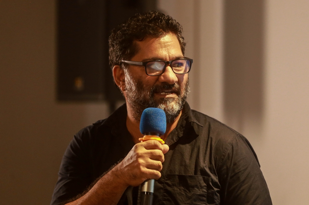 Hameed from Pakistan speaking during the International Iftar here at C-Space, Central Market. — Picture by Sayuti Zainudin