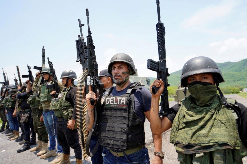 Members of the Jalisco New Generation Cartel (CJNG), led by Nemesio Oseguera, known as ‘El Mencho,’ pose for a photo at an undisclosed location in Michoacan state, Mexico, July 1, 2021. — Reuters/Stringer pic