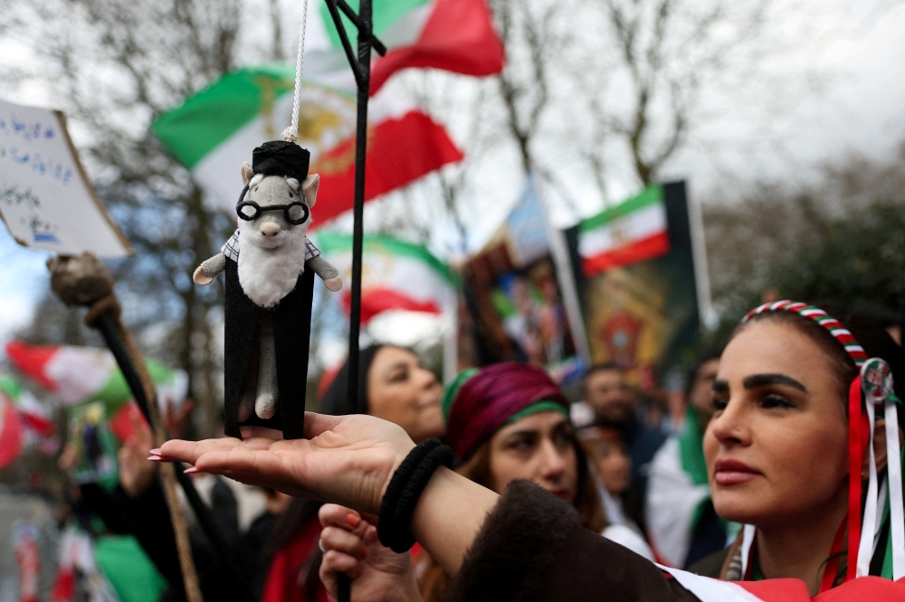 A puppet depicting Iran's Supreme Leader Ayatollah Ali Khamenei hangs from a noose, as demonstrators gather in support of military action against the Iranian regime, following strikes by the US and Israel against Iran, outside the Iranian embassy in London, Britain, February 28, 2026. — Reuters pic 