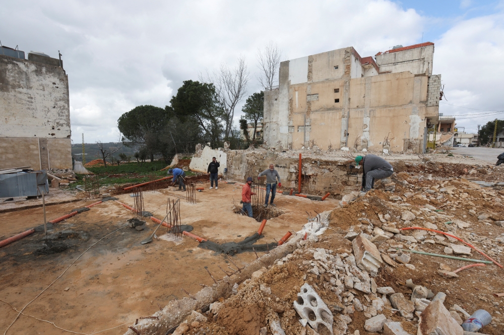 Men work at a construction site that was damaged during the previous hostilities between Israel and Hezbollah, in the Lebanese village of Khiam, near the border with Israel, southern Lebanon, February 19, 2026. — Reuters pic 